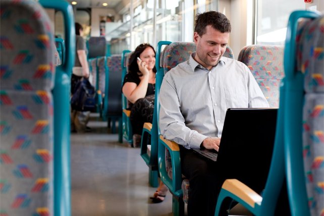 Man on the bus with his laptop